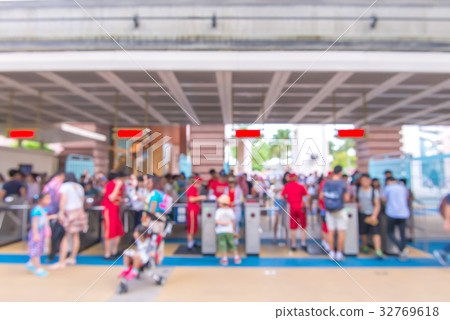 blur people at queue in front of exhibition gate 32769618