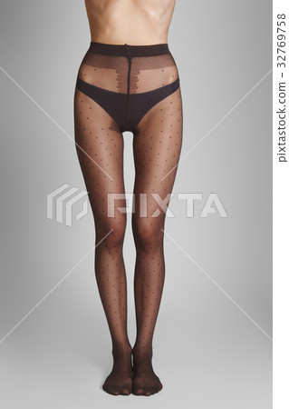 Female legs in tights with polka dot pattern 32769758