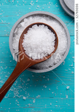 sea salt in stone bowl and wooden spoon sea salt in stone bowl and wooden spoon 32769898