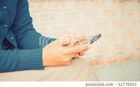 woman using phone woman using phone 32770053