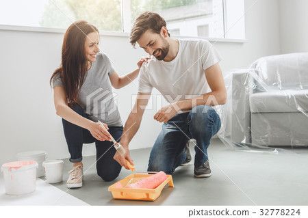 Young couple doing apartment repair together Young couple doing apartment repair together 32778224