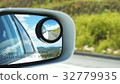 Side rear view mirror on a car 32779935