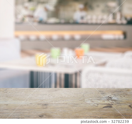 wooden table top with restaurant interior 32782239