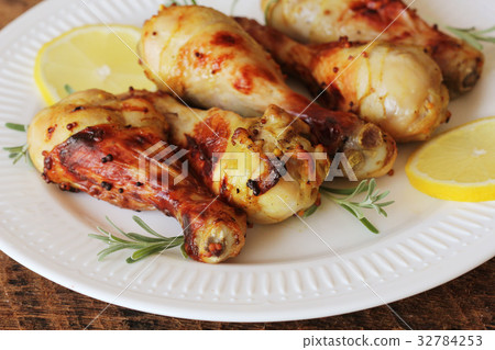 Grilled chicken legs with mustard on wooden table Grilled chicken legs with mustard on wooden table 32784253