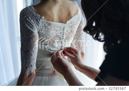 wedding dress hanging on the mirror wedding dress hanging on the mirror 32785567