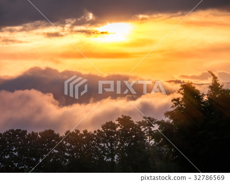 Sun ray on the morring with clouds and fog Sun ray on the morring with clouds and fog 32786569