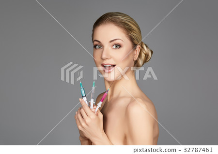 beautiful girl holding syringes beautiful girl holding syringes 32787461
