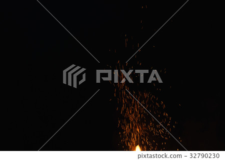 hot spark from campfire over night sky 32790230