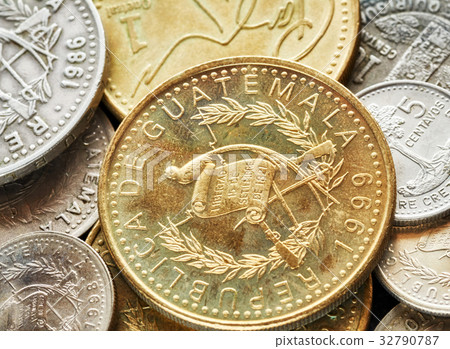 close up picture of Guatemalan quetzal coins. close up picture of Guatemalan quetzal coins. 32790787