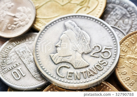 close up picture of Guatemalan quetzal coins. close up picture of Guatemalan quetzal coins. 32790788