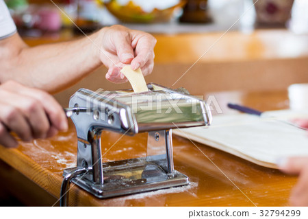 Man making homemade pasta at home Man making homemade pasta at home 32794299