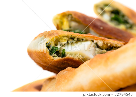 Delicious sliced puff pie with eggs. Delicious sliced puff pie with eggs. 32794543