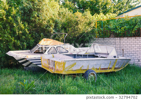 Two old abandoned boats in the yard Two old abandoned boats in the yard 32794702