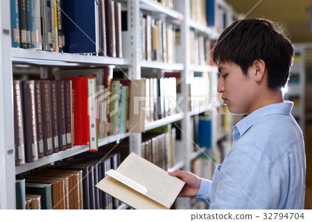 University student doing research in library University student doing research in library 32794704