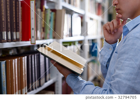 University student doing research in library University student doing research in library 32794705