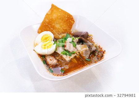 Spicy tom yum noodle with egg and pork. Spicy tom yum noodle with egg and pork. 32794981