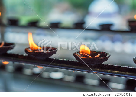 Coconut oil lamps in temple Coconut oil lamps in temple 32795015