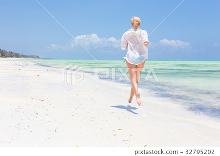 Happy woman having fun, enjoying summer, running Happy woman having fun, enjoying summer, running 32795202