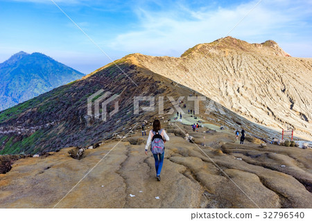 tourist trekking along dusty section of Ijen trail tourist trekking along dusty section of Ijen trail 32796540