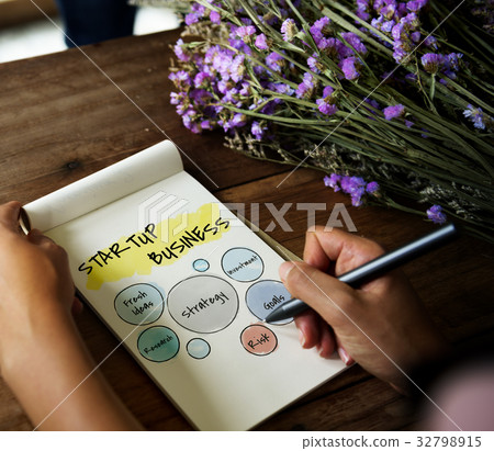 Hand working on notepad network graphic overlay Hand working on notepad network graphic overlay 32798915