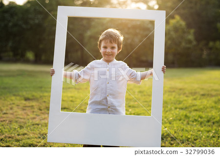 Boy is standing in the park Boy is standing in the park 32799036