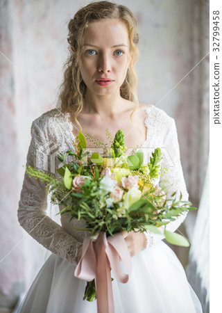 Attractive Beautiful Bride Holding Flowers Bouquet 32799458