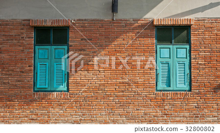 Blue window with brick wall Blue window with brick wall 32800802
