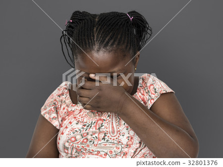 Little african girl laughing casual studio portrait Little african girl laughing casual studio portrait 32801376
