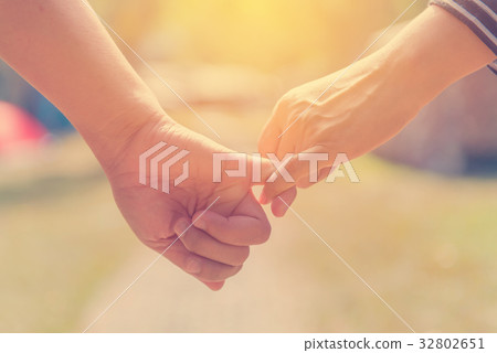 Happy couple holding hands together forever love  32802651