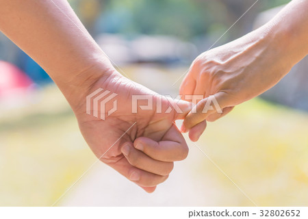 Happy couple holding hands together forever love  32802652