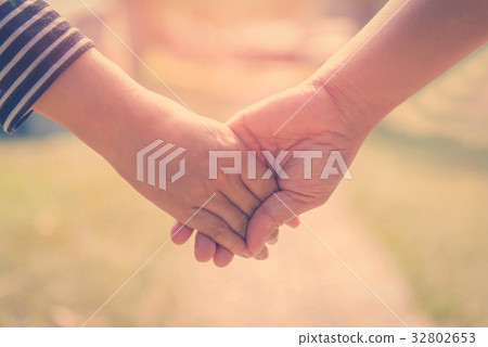Happy couple holding hands together forever love  32802653