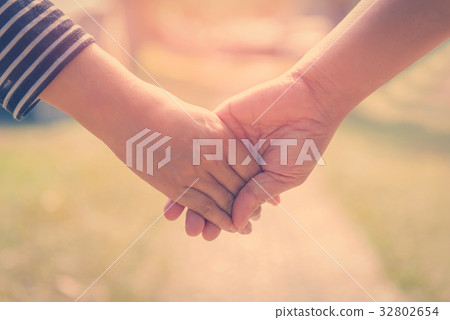 Happy couple holding hands together forever love  32802654