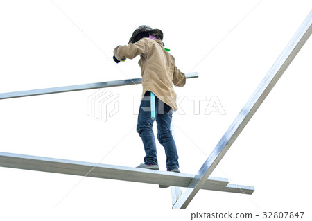 Construction workers working on roof frame Construction workers working on roof frame 32807847