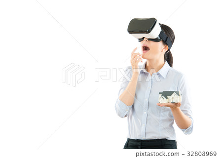 excited woman using a VR headset 32808969