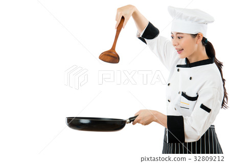 beautiful chef holding a wooden spatula beautiful chef holding a wooden spatula 32809212