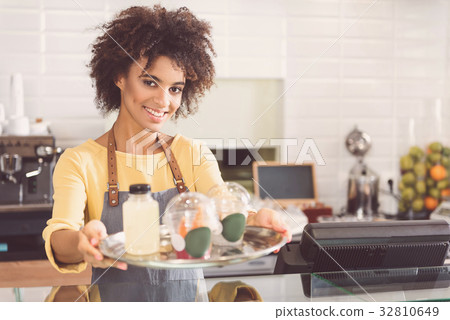 Happy charming girl is working in organic shop 32810649