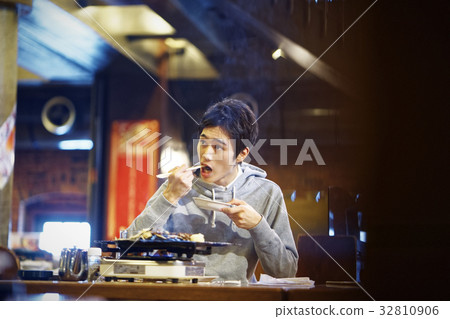 Men tasting Genghis Khan 32810906