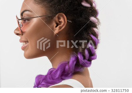 Joyful cute teenager with glamour violet pigtails Joyful cute teenager with glamour violet pigtails 32811750