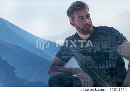 Thoughtful guy relaxing in natural environment 32811934