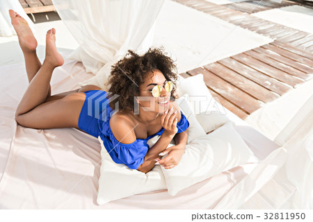 Cheery young mulatto lady taking pleasure of 32811950