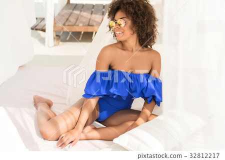 Happy youthful mulatto lady spending free time on Happy youthful mulatto lady spending free time on 32812217