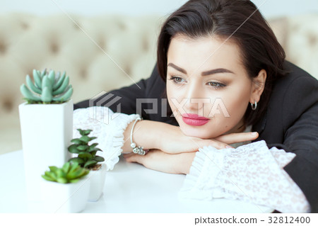 Portrait of a woman with sad eyes. 32812400