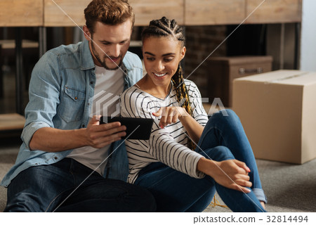 Delighted couple of loving people watching Delighted couple of loving people watching 32814494