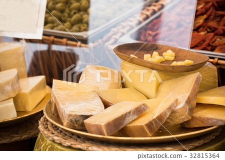 Chunks of different cheeses at a local market Chunks of different cheeses at a local market 32815364