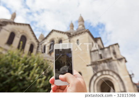 Tourist taking photo of Perigueux, France 32815366