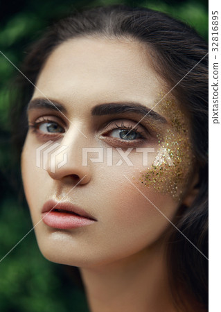 Brown eye surrounded by special golden elements Brown eye surrounded by special golden elements 32816895