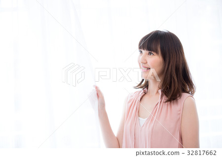 Woman by the window 32817662