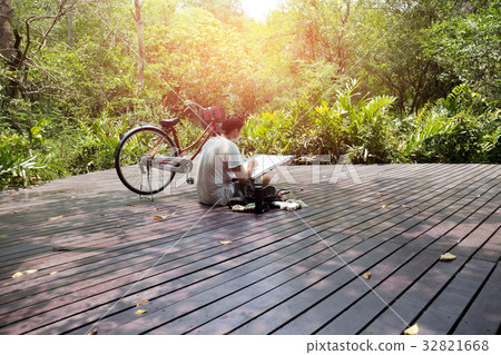 Artist sketching nature on drawing board with Artist sketching nature on drawing board with 32821668