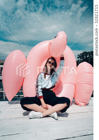 Young beautiful girl posing on the pier 32821715