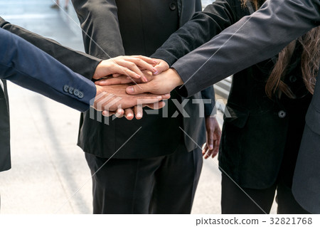 Group of business people joining hands. Group of business people joining hands. 32821768